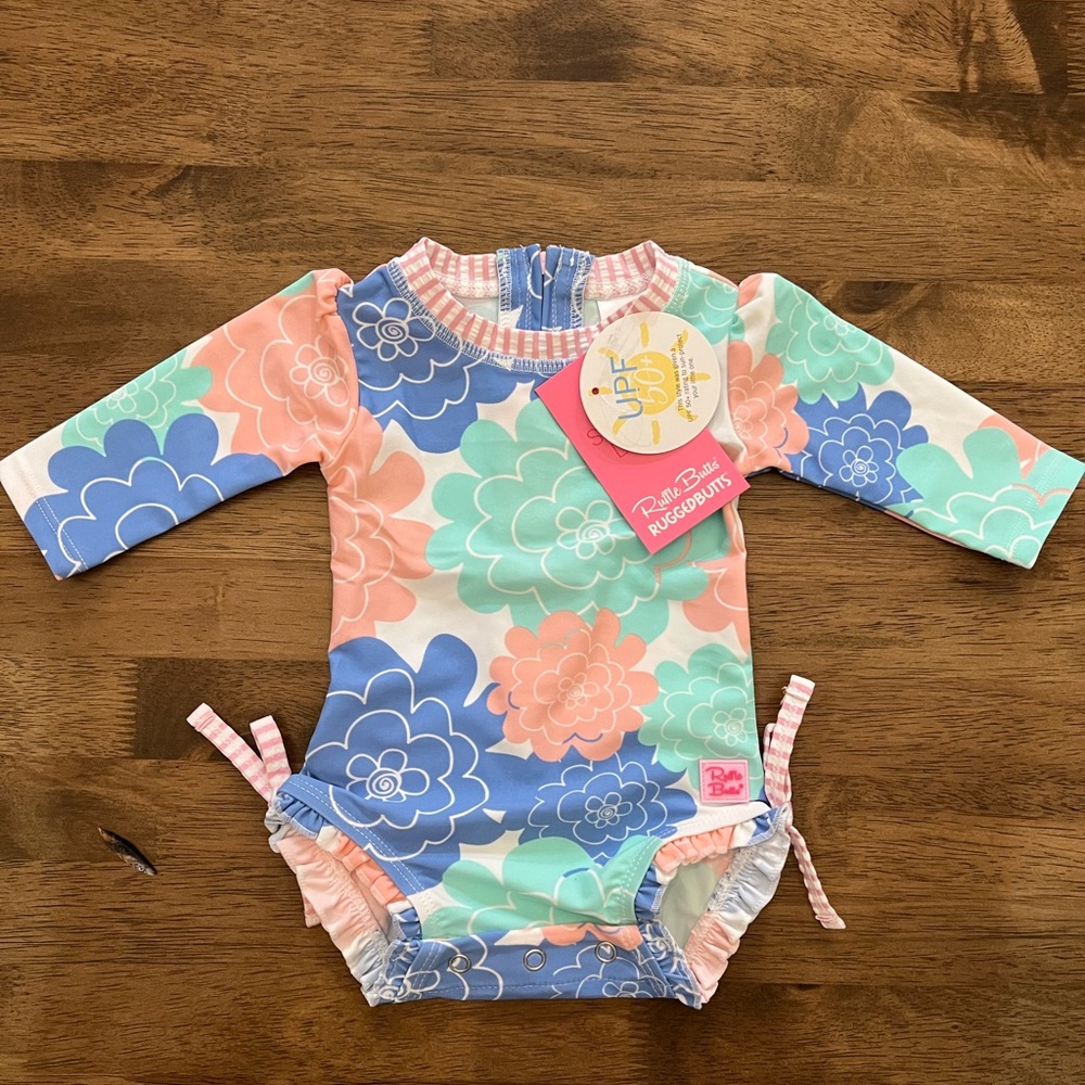 Ruffle Butts swim suit 0-3 months. Brand new.